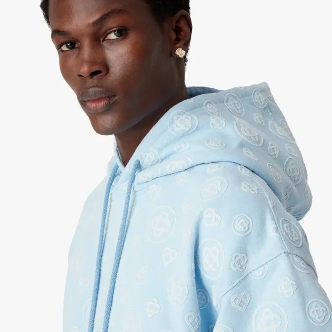 Hettegenser med applikert monogram