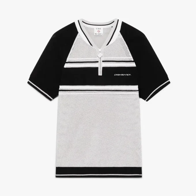 Polo-skjorte med korte ermer, glidelås og metalliske mesh-striper på shortsen