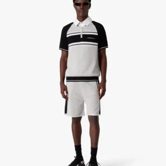 Polo-skjorte med korte ermer, glidelås og metalliske mesh-striper på shortsen