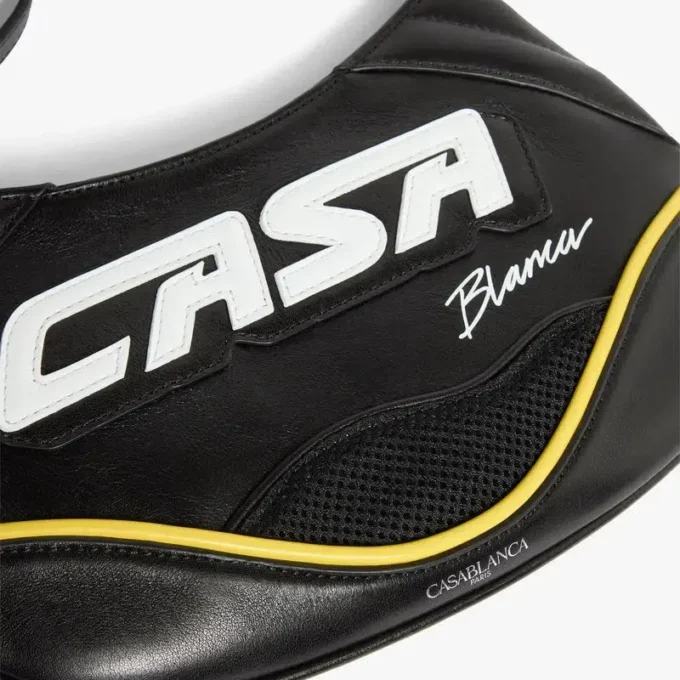 Svart, slank biker-veske